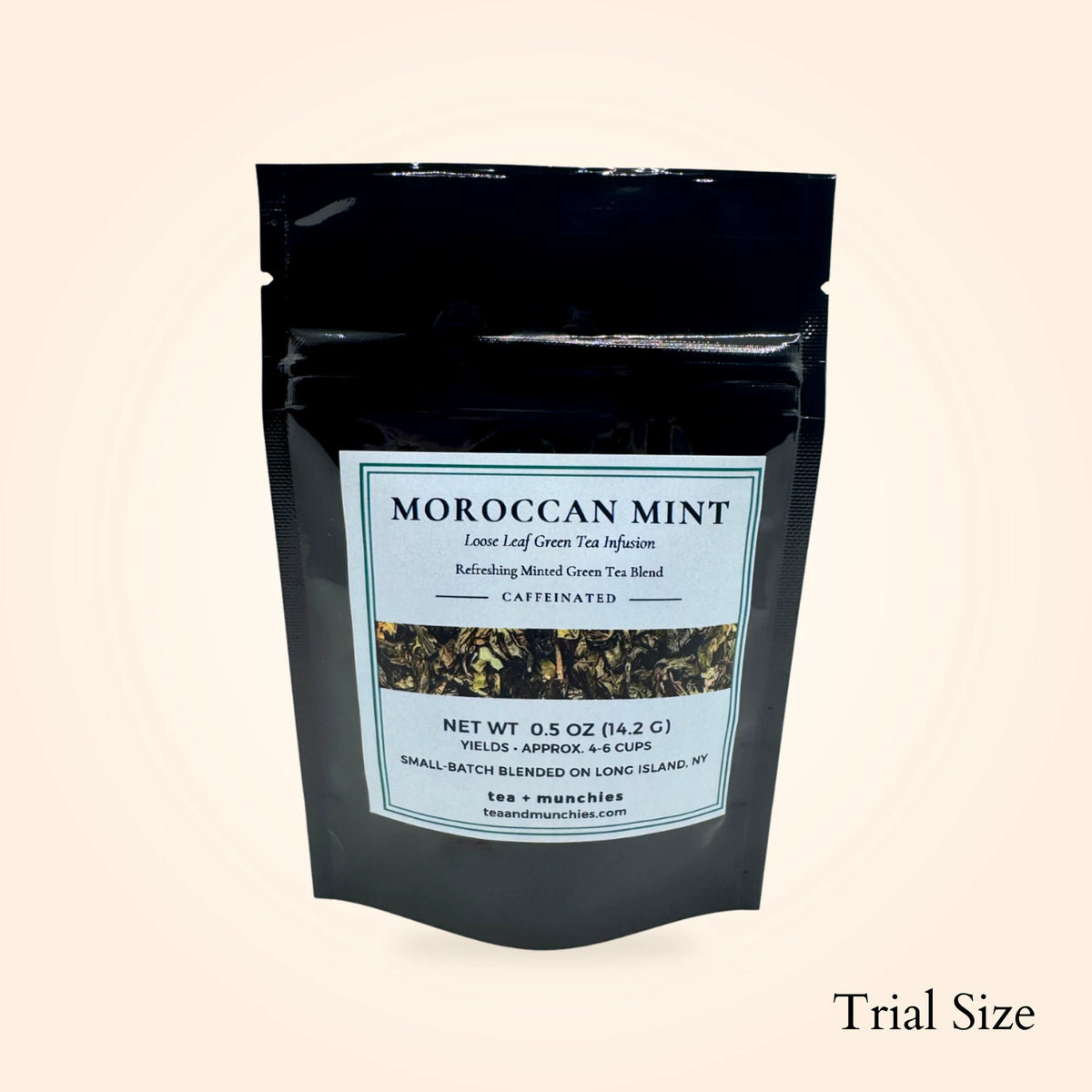 tea + munchies Moroccan Mint green tea in a trial-size black pouch on a warm neutral background