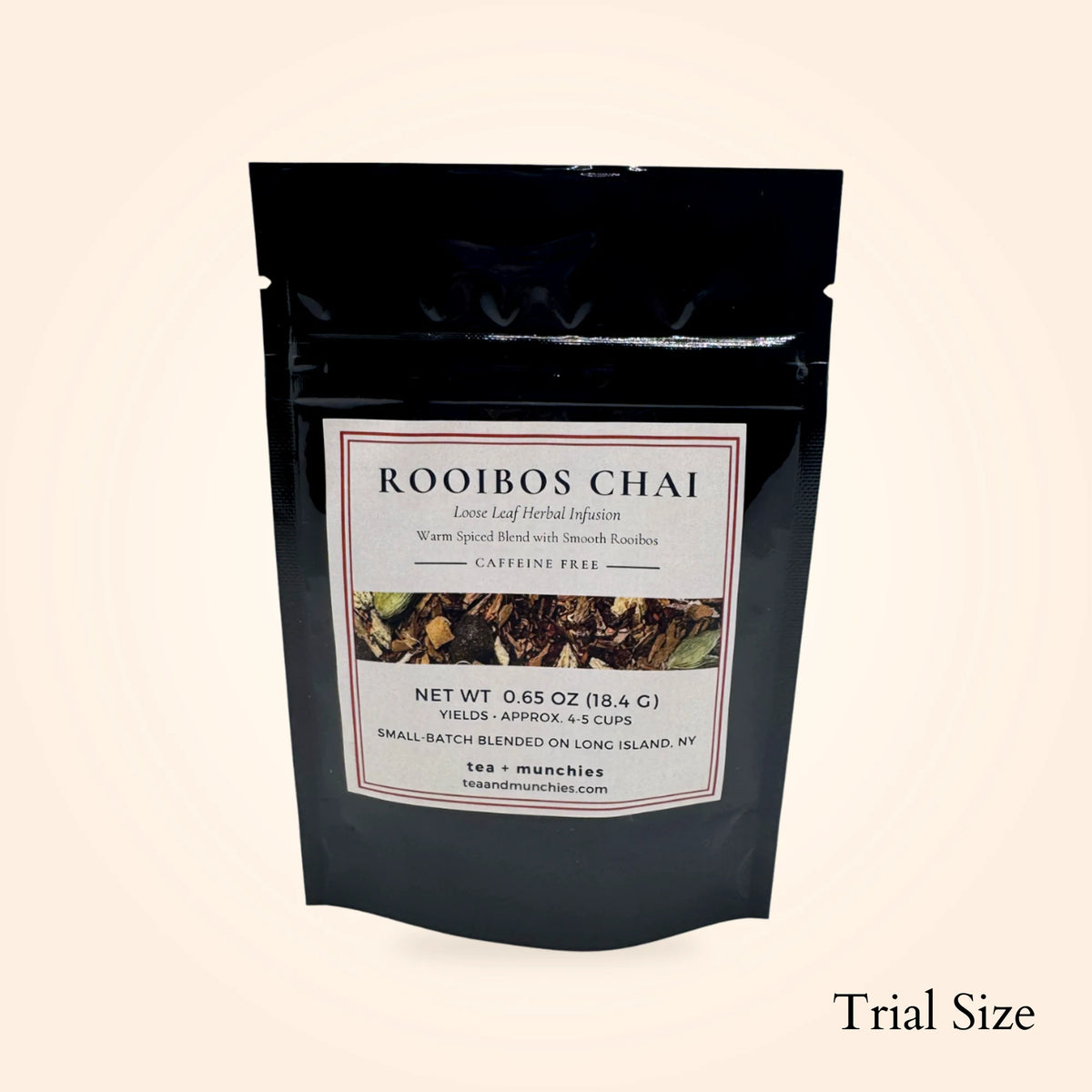 Resealable black glossy stand-up package of trial size loose leaf rooibos chai herbal tea on white background. 'Trial size' written in lower right hand corner | tea + munchies
