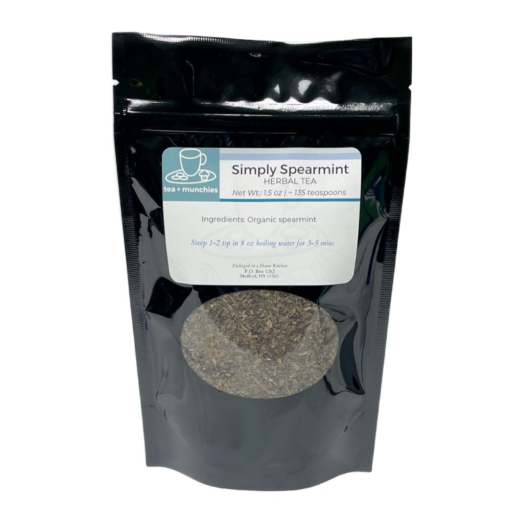 Resealable black glossy stand-up package of loose leaf spearmint herbal tea on white background | tea + munchies