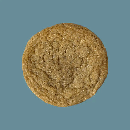 Soft baked vegan rooibos chai cookie made with homemade vegan butter on teal background | tea + munchies
