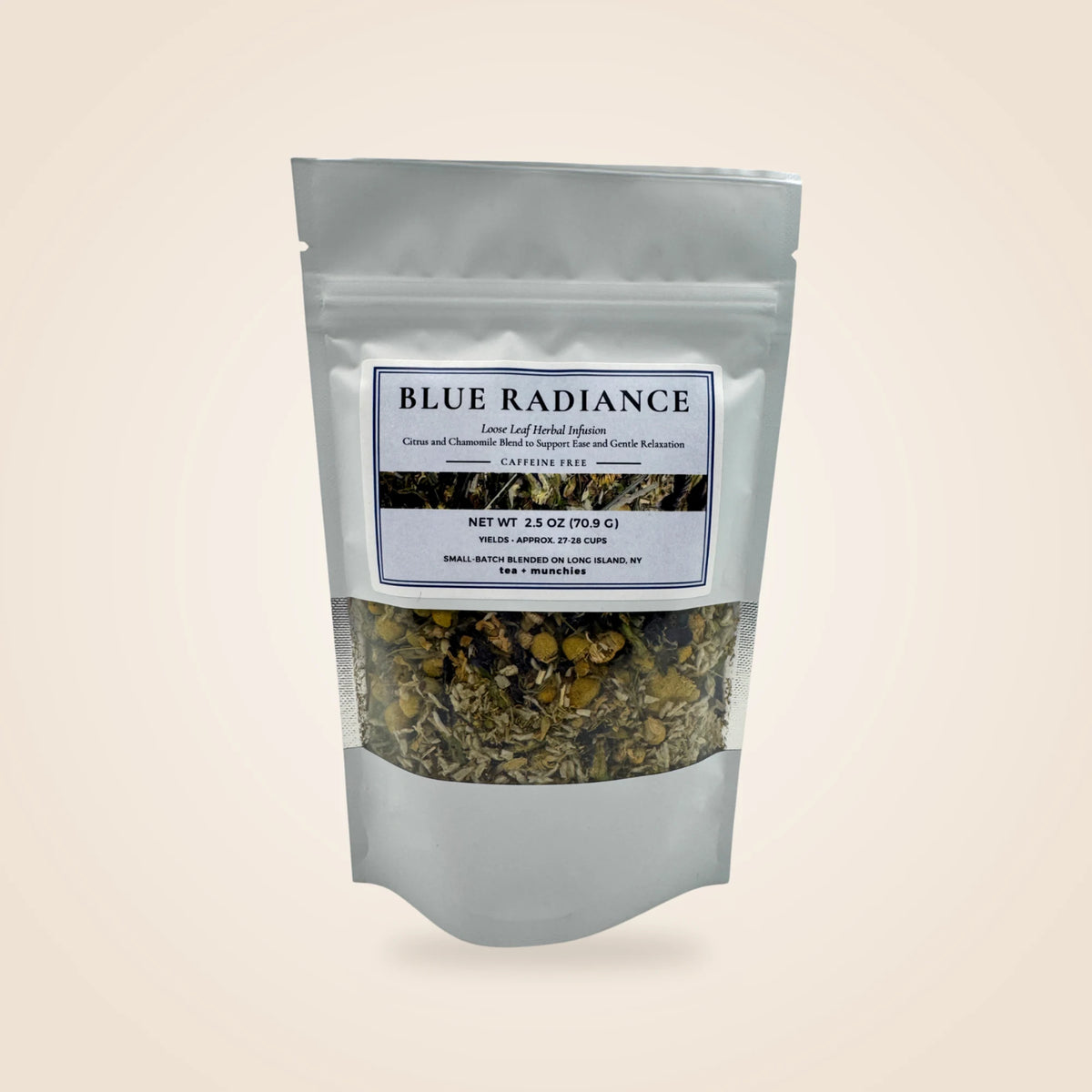 A white stand-up pouch of Blue Radiance herbal tea blend with a clear window showing the dried tea mixture inside, set against a solid light beige background.