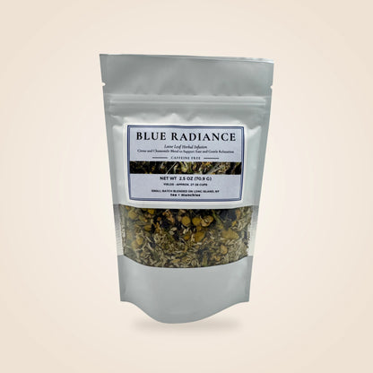 A white stand-up pouch of Blue Radiance herbal tea blend with a clear window showing the dried tea mixture inside, set against a solid light beige background.