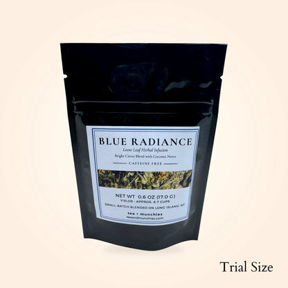 A black stand-up pouch of Blue Radiance loose leaf herbal infusion tea on a light beige background, with 'Trial Size' text in the bottom right corner.