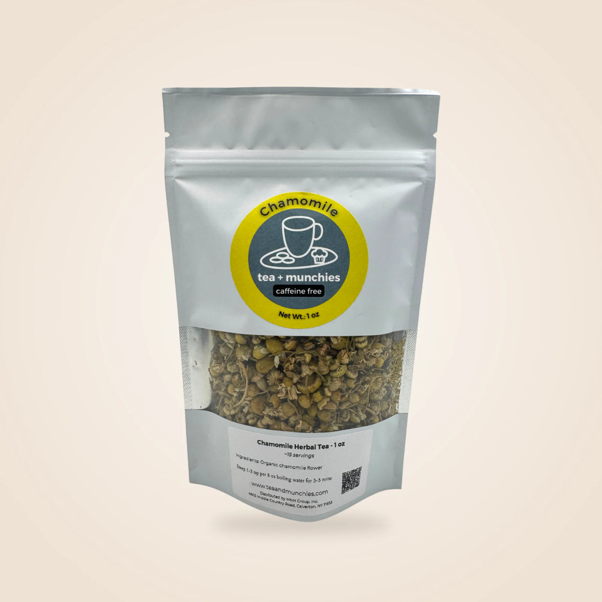 A stand-up pouch of chamomile herbal tea with a clear window showing the loose tea inside. The packaging is white with a circular yellow and dark green label reading 'Chamomile tea + munchies caffeine free'.