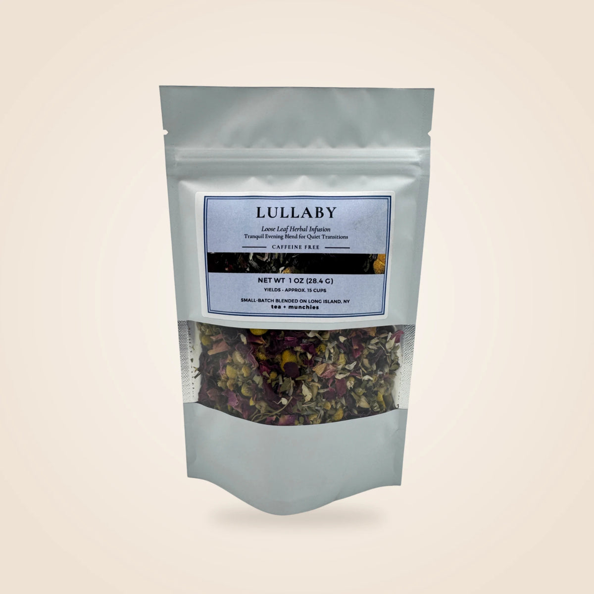A white stand-up pouch of Lullaby herbal tea with a clear window showing dried herbs and flowers inside, set against a solid beige background.