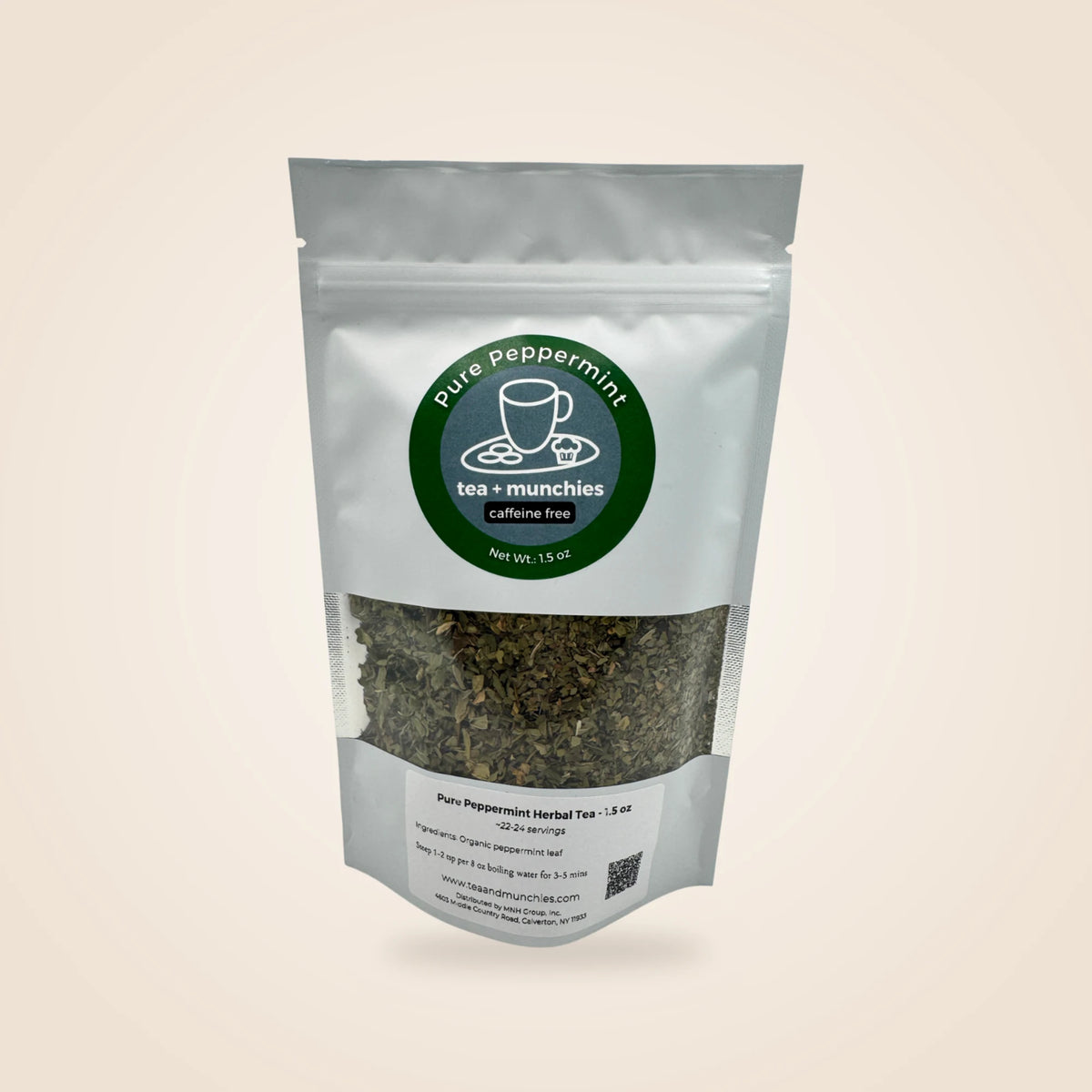 A stand-up pouch of Pure Peppermint Tea by tea + munchies, featuring a white foil package with a clear window showing loose-leaf tea inside, set against a solid light beige background.