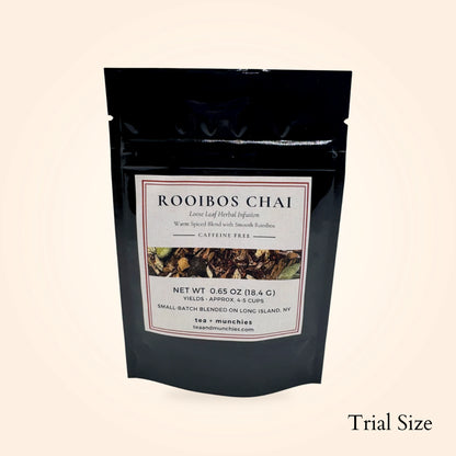 Resealable black glossy stand-up package of trial size loose leaf rooibos chai herbal tea on white background. 'Trial size' written in lower right hand corner | tea + munchies