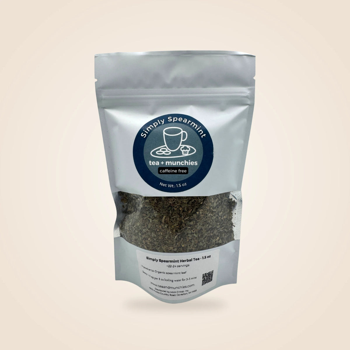 Simply Spearmint Caffeine Free herbal tea in a white stand-up pouch with a clear window showing the loose leaf tea inside, set against a solid light beige background.