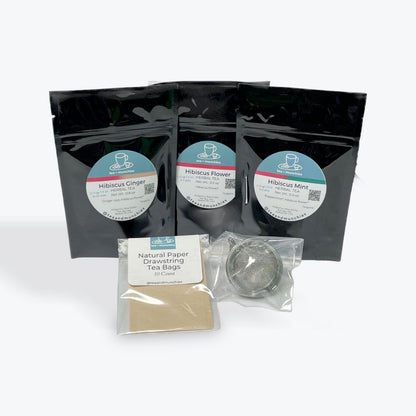 Hibiscus Delight Tea Gift Set Box Contents: trial size Hibiscus Flower, Hibiscus Ginger, & Hibiscus Mint loose leaf teas with mesh ball infuser and 10 natural paper drawstring tea bags | tea + munchies