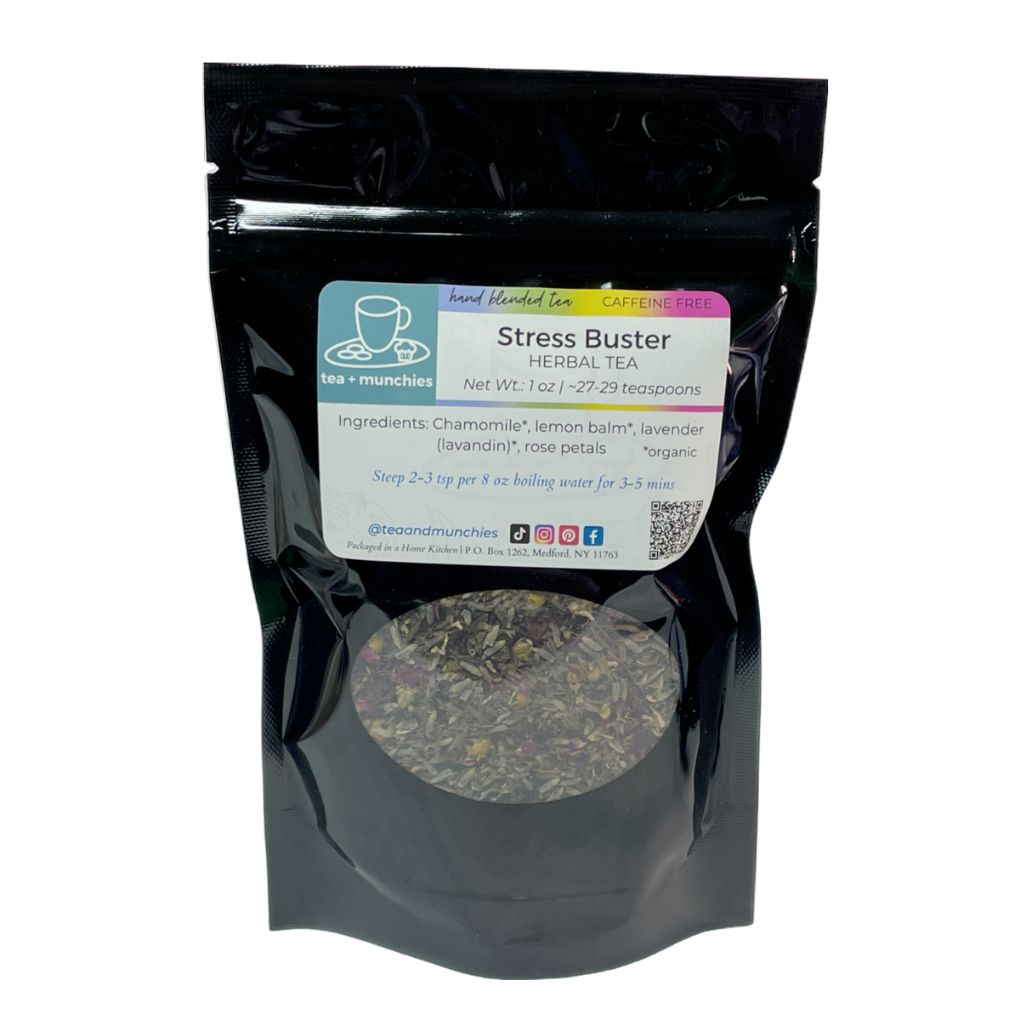 Resealable black glossy stand-up package of loose leaf stress buster herbal tea on white background | tea + munchies