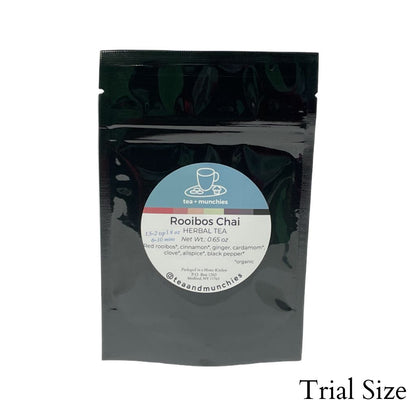 Resealable black glossy stand-up package of trial size loose leaf rooibos chai herbal tea on white background. 'Trial size' written in lower right hand corner | tea + munchies